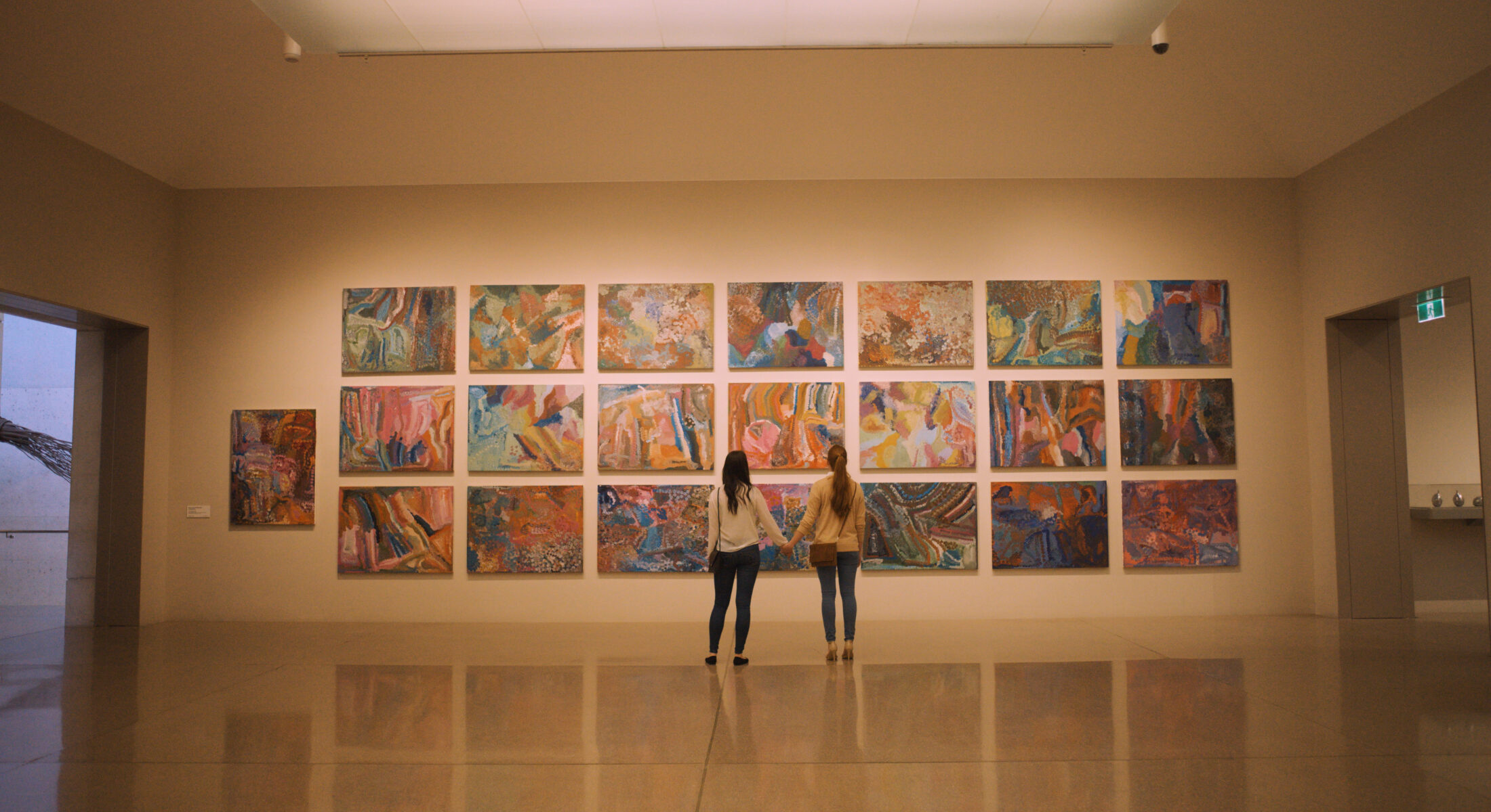 Couple viewing artwork by Emily Kame Kngwarreye at NGA